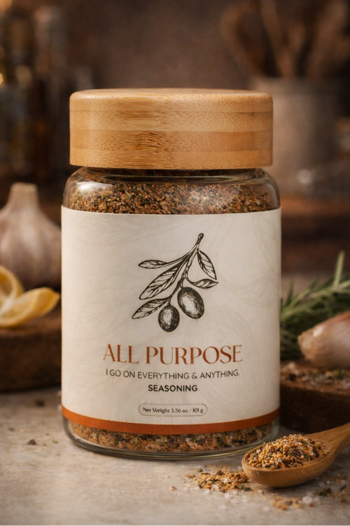 Jar of all-purpose seasoning with a wooden spoon 